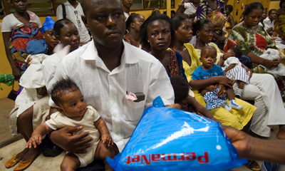 Families receiving malaria bed nets. Ghana. Photo: © Arne Hoel / The World Bank