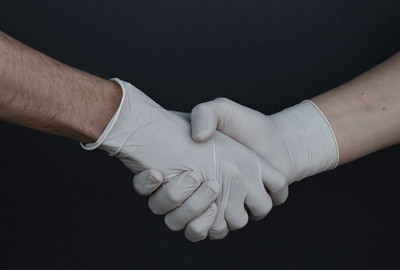 Handshake in gloves: Unsplash