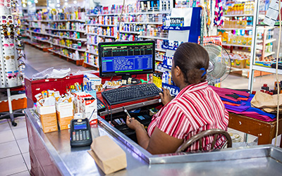Clerk at a supermarket, Tanzania. Image: Imani Nsamila / UNU-WIDER